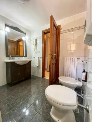 a bathroom with a toilet and a sink at B&B Andy&LU in Rome