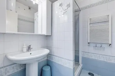 a white bathroom with a sink and a shower at BigFamilyRome - Spanish Steps in Rome