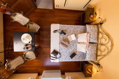 an overhead view of a table with items on a wooden floor at BigFamilyRome - Sistine Chapel in Rome