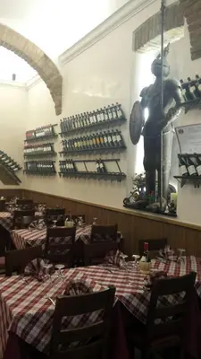 a restaurant with tables and a statue of a man at Hotel Castelfidardo in Rome