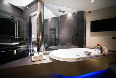 a bathroom with a tub and a sink and a shower at Le Stanze Di Federica in Rome
