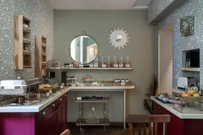 a kitchen with a counter with a sink and a mirror at Glance in Rome in Rome