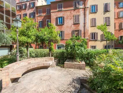 a bridge in a city with buildings in the background at TREVI luxury with terrace in Rome