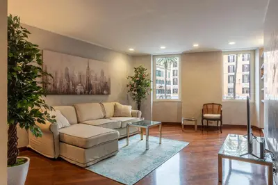 a living room with a couch and a table at Piazza di Spagna 90 Exclusive Apartment in Rome