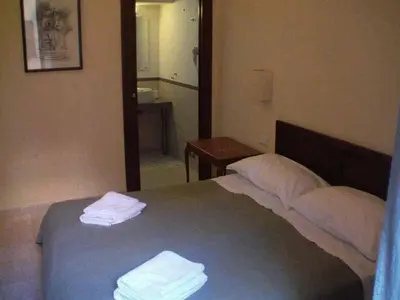 a bedroom with a bed with two towels on it at B&B La Casa Di Rosy in Rome