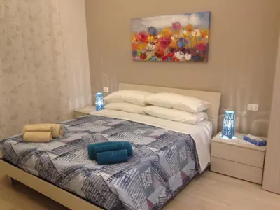 a bedroom with a bed with two pillows on it at Stephen Accommodation in Rome