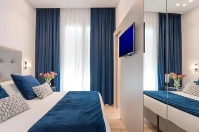 a hotel room with a bed and a tv at Residenza Zanardelli in Rome