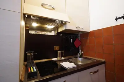 a small kitchen with a sink and a stove at MGPgroup Rome Center Hot Spot in Rome