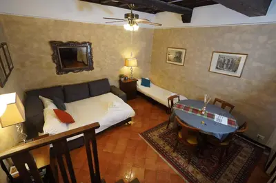 a room with a bed and a table with a boat on it at MGPgroup Rome Center Hot Spot in Rome