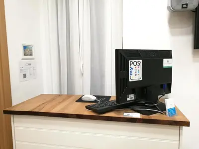 a computer sitting on top of a desk at Al Trenino accomodation in Rome