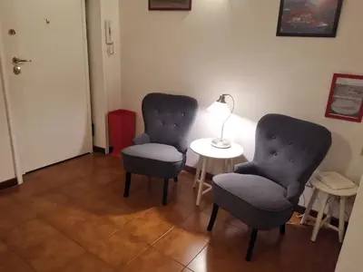 two chairs and a table with a lamp in a room at homedieci in Rome