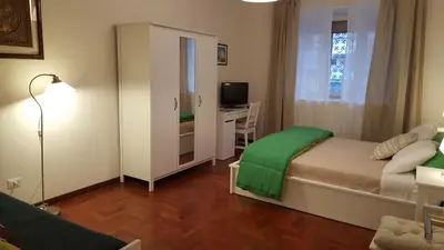 a small bedroom with a bed and a desk at homedieci in Rome
