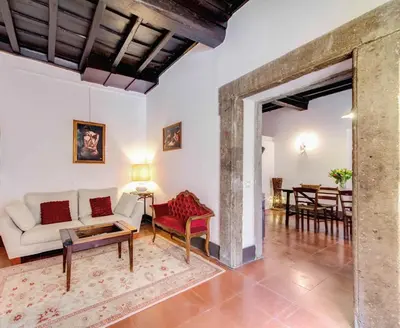 a living room with a couch and a table at Campo dei Fiori Stunning and Quiet in Rome