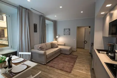 a living room with a couch and a table at Laura Family Apartments in Rome
