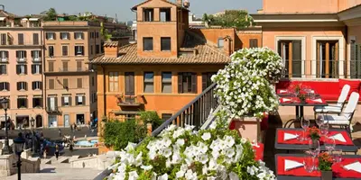 a view of a city from a balcony with flowers at Il Palazzetto in Rome