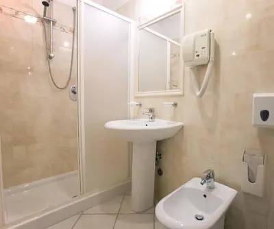 a bathroom with a sink and a shower and a toilet at Hotel Domus Praetoria in Rome