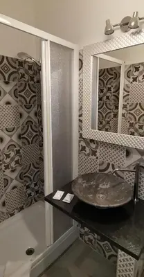 a bathroom with a sink and a mirror at Sun Moon in Rome