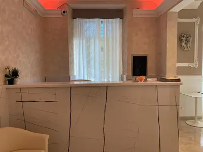 a kitchen with a large counter with a window at Alex Romano in Rome