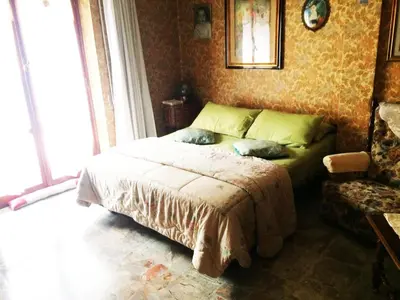 a bedroom with a bed with two pillows on it at Palini's House in Rome