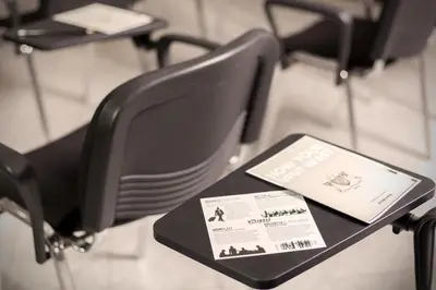 a black chair with a book on a table at Villa Pirandello in Rome