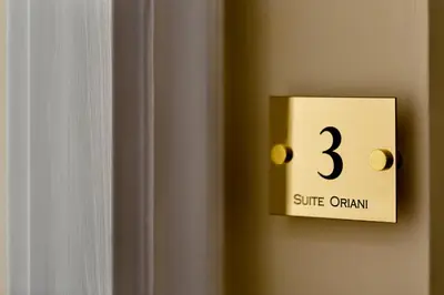 a lightswitch with the number three on a wall at Suite Oriani in Rome