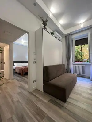 a living room with a couch and a bedroom at ARTPA Rome Apartments in Rome