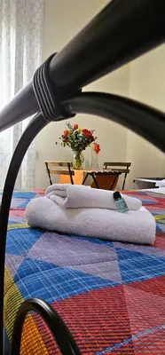 a group of towels sitting on top of a bed at Titina B&B in Rome