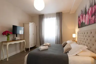 a bedroom with a large bed and a window at Dream Holiday Home in Rome