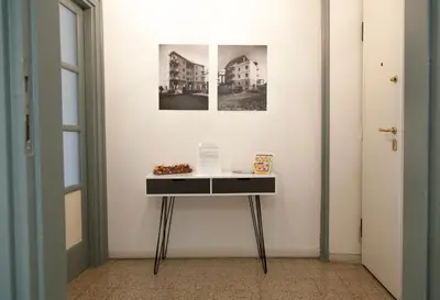 a table in a room with a picture on the wall at Miani House in Rome
