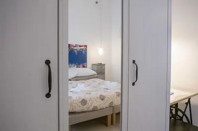 a bedroom with a bed and a table with a desk at Tempo Lento in Rome