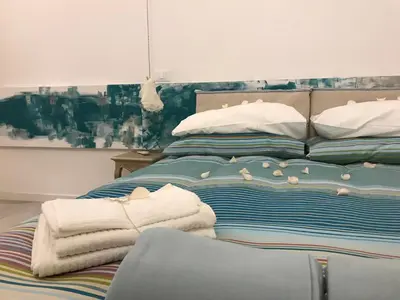 a bedroom with a bed with towels on it at Tempo Lento in Rome