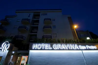 a hotel building with a sign in front of it at Hotel Gravina San Pietro in Rome