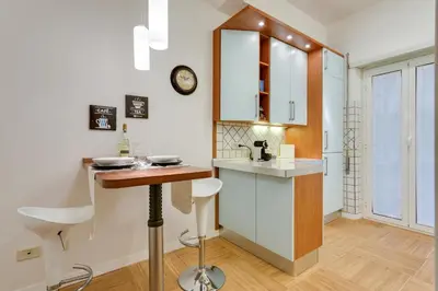 a kitchen with a counter and a sink in a room at Goldie in Rome