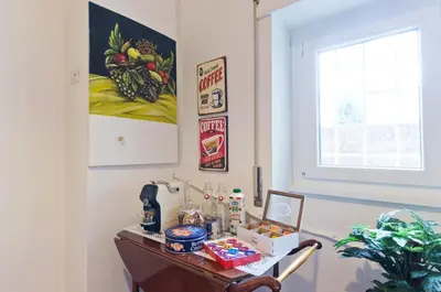 a table with food on it next to a window at Liberty Trastevere B&B in Rome