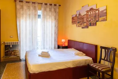 a bedroom with a bed with towels on it at Cleopatra in Rome