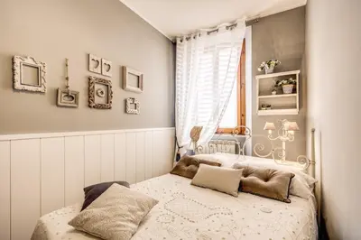 a bedroom with a bed and a window at Spanish Steps Miracle Suite in Rome