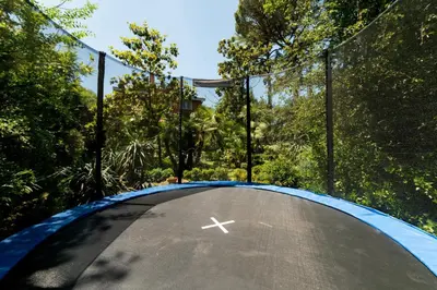 a jump on a trampoline in a park at Domus Quiritum Villa in Rome