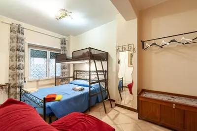 a bedroom with a bed and a bunk bed at Vatican Mami in Rome