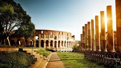 ancient ruins of a building with columns in a yard at Suites Roma Tiburtina in Rome