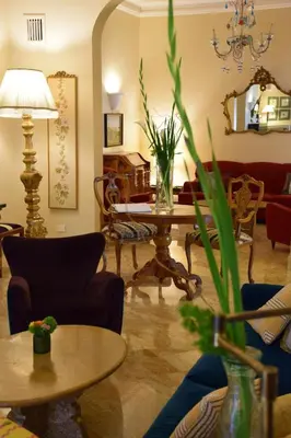 a living room with a couch and a table at Hotel Lancelot in Rome