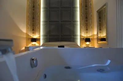 a white bath tub in a room with a mirror at Navona Nice Room in Rome