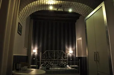 a room with a bed and a table and a mirror at Navona Nice Room in Rome