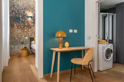 a room with a table and a washing machine at Casa Scalzi in Rome