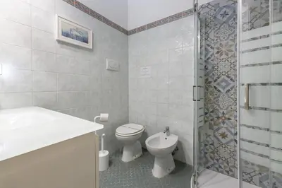 a bathroom with a toilet and a sink and a shower at Pantheon Palazzo Nari in Rome
