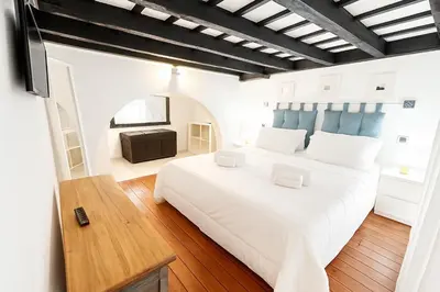 a bedroom with a large white bed in a room at Trastevere Stars in Rome