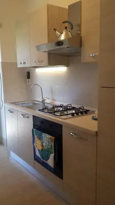 a kitchen with a stove and a sink at Roma Caput Mundi in Rome