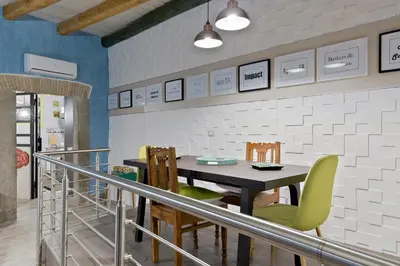 a dining room with a table and chairs at Rome As You Feel - Design Apartment at Colosseum in Rome