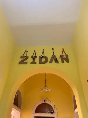 an archway with a pharmacy sign on the ceiling at Zidan Guest House in Rome
