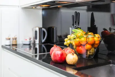 a bowl of fruit on a counter in a kitchen at Luxury Apartment Casa Farnese – Campo de Fiori in Rome