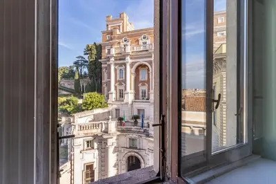 an open window with a view of a building at DOWNTOWN SRL - Imperial Panorama Penthouse in Rome
